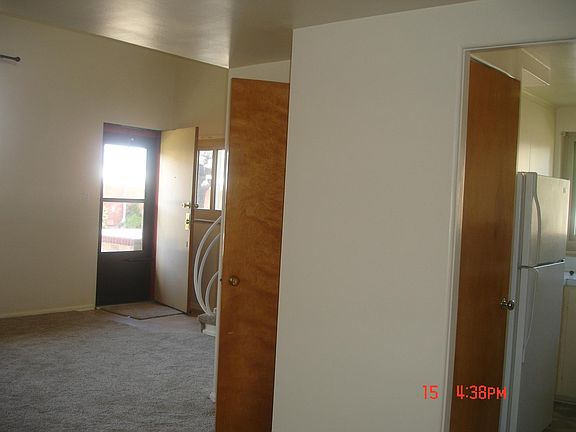 front door, living room, closet under the stairs and kitchen