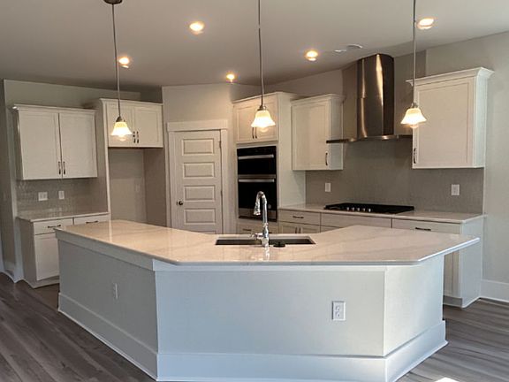 The Kitchen offers plenty of cabinet and counter space.