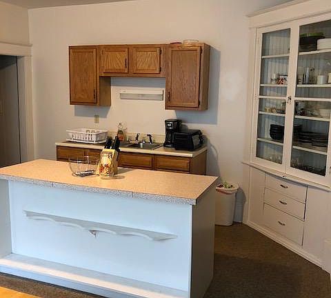 Kitchen, island and built-in curio cabinet