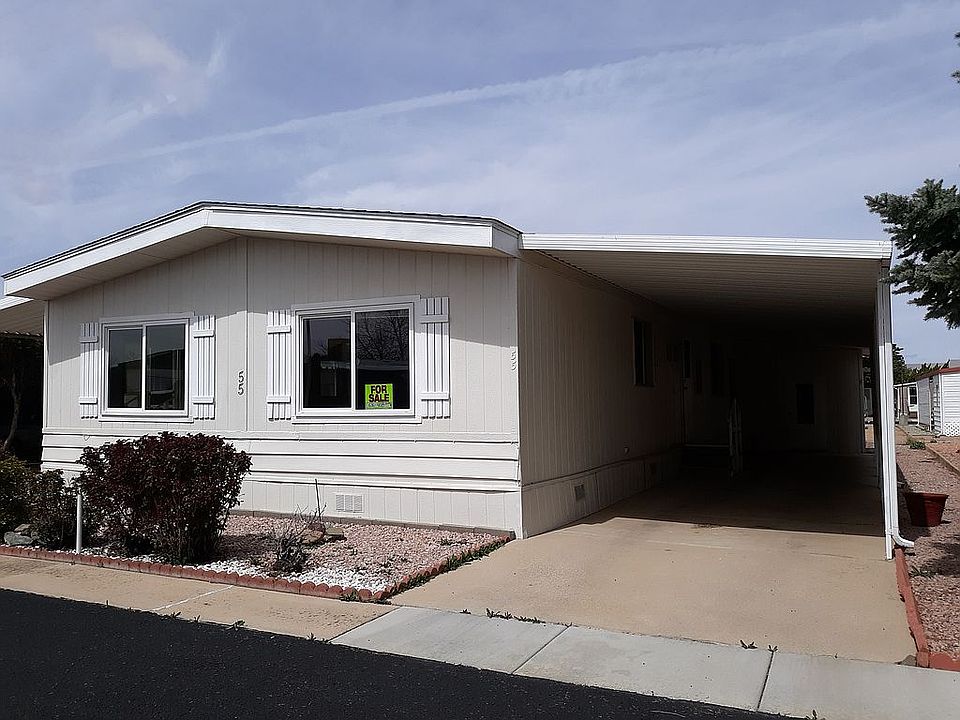 Front w carport & storage