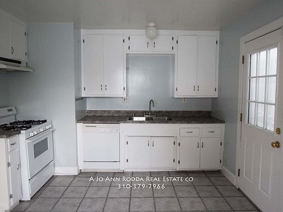 Kitchen. Stove. Dishwasher. Back door.