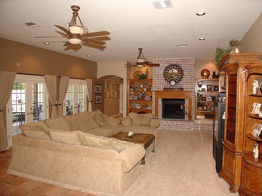 Family room open to kitchen and breakfast area.  French doors to back yard