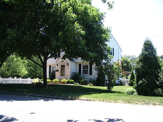 nestled on 2 lots behind the White Picketts!