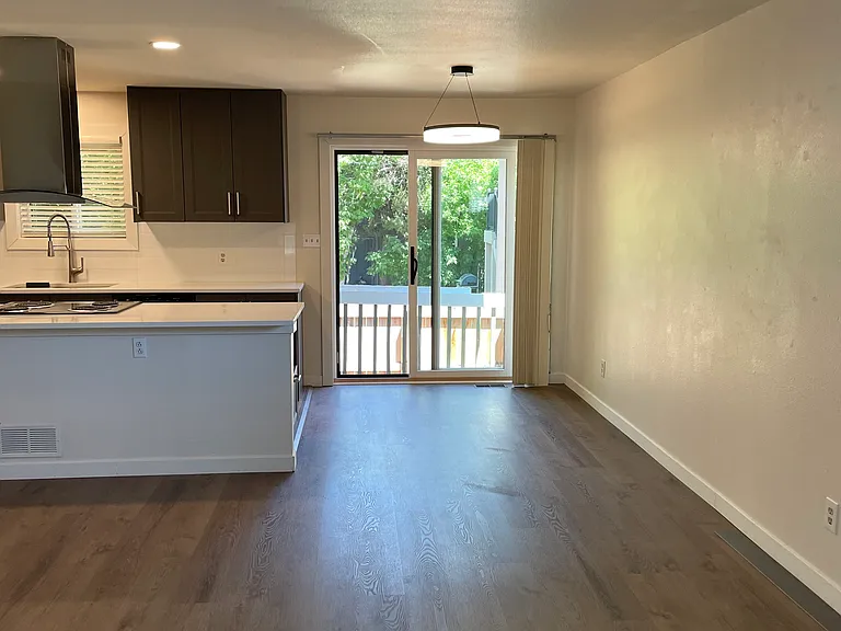 View from living room to dining area and kitchen