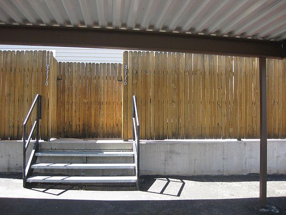 Entrance to back patio and townhouse from parking space