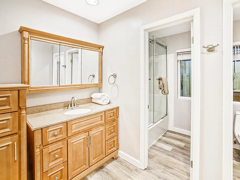 Shower/Bathroom in separate rooms.