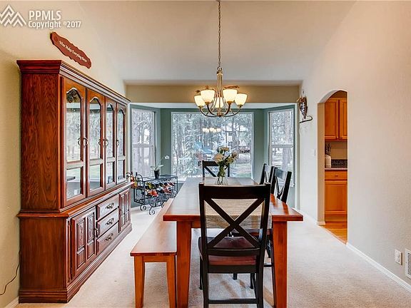 Large formal dining room with bay window, vaulted ceiling and lots of natural li