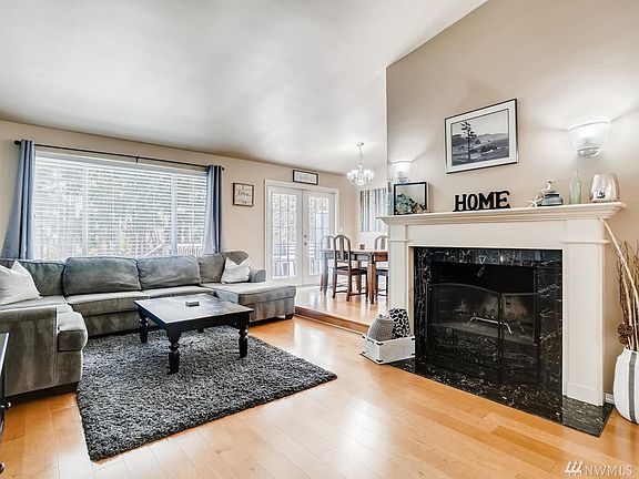 Gleaming floors, wide windows, a craftsman style fireplace and more