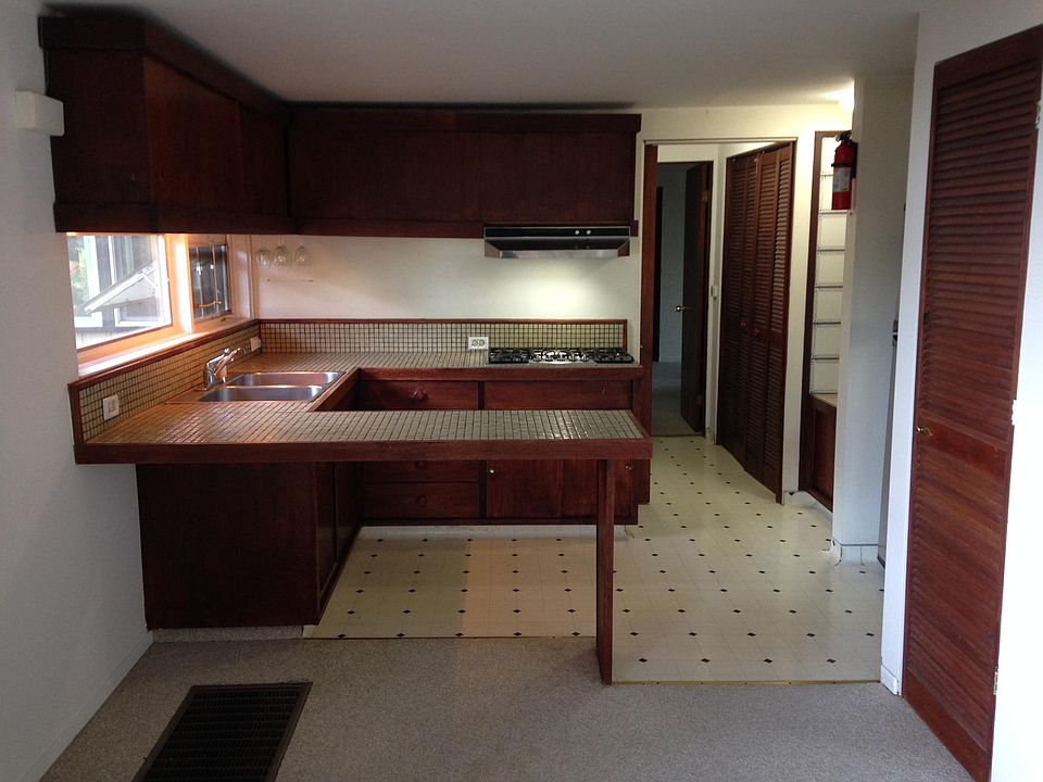 kitchen has gas stove, oven,  microwave, fridge.