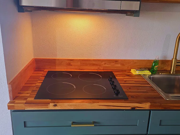 Stylish ceramic cooktop with beautiful decor that enhances every stay.