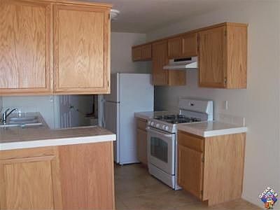 Tile counters and floors in kitchen. Newer appliances
