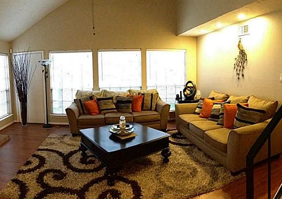 Beautiful Interior with Laminate Flooring and High Ceilings