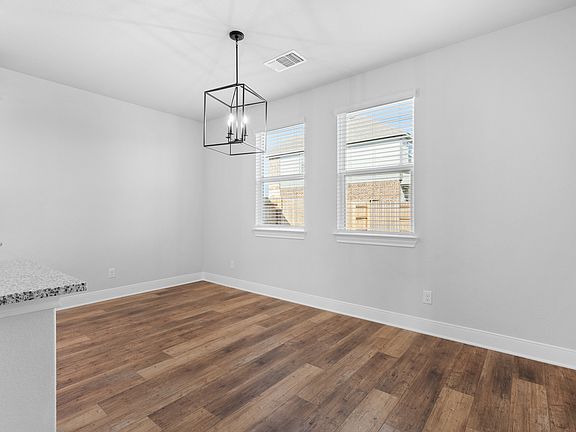 The dining room sits right next to the kitchen.