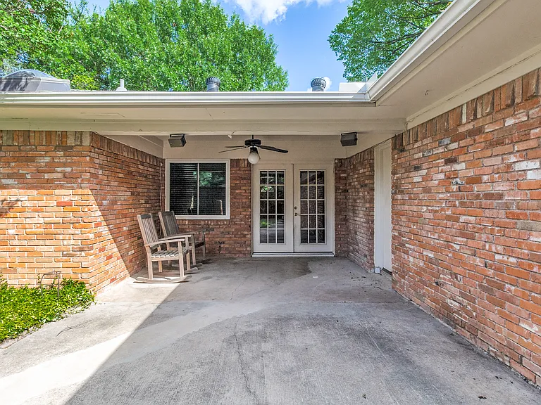 Grab your cold beverage and relax out on the covered porch that's equipped with a lighted fan.