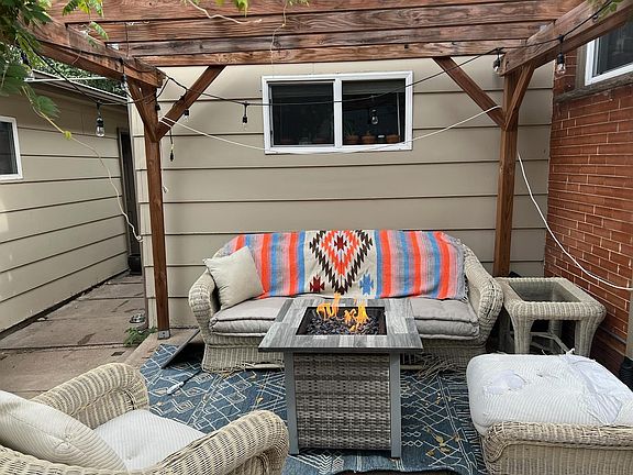 Pergola out back. BBQ grill included. Has a garden area.
