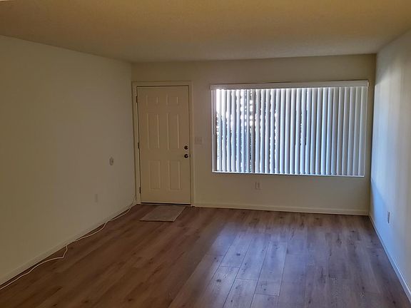 Living Room w/new floors and fresh paint