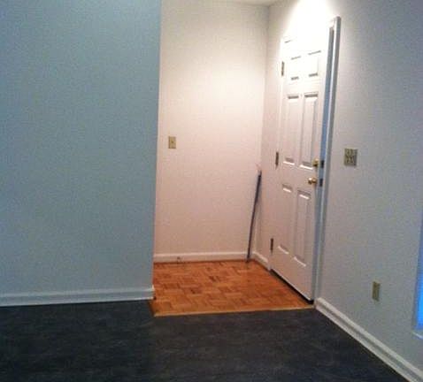 Front door faces staircase and entry to living room.