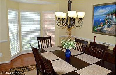 Dining Room with bay window and decorative columns