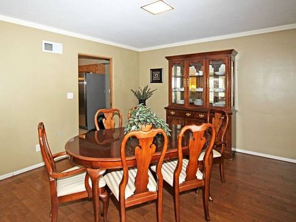The dining area is large enough to seat the largest of families during holiday dinners.  The kitchen is conveniently located to the left.