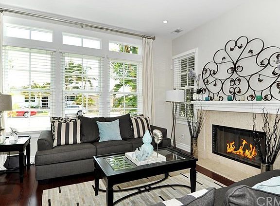 The formal living area has one of the three fireplaces in this amazing home!