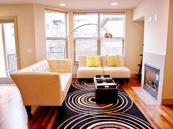 Spacious living place with expansive windows and gas fireplace
**BRAND new floor carpet and fresh paint**
