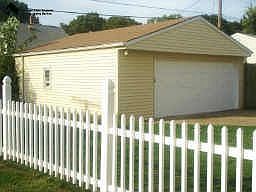 Fenced backyard with 2 car garage
