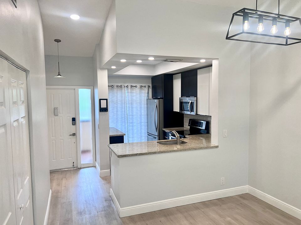 Dining Room & Open Kitchen - 2281 SW 15th St. 148 Deerfield Beach, FL 33442
