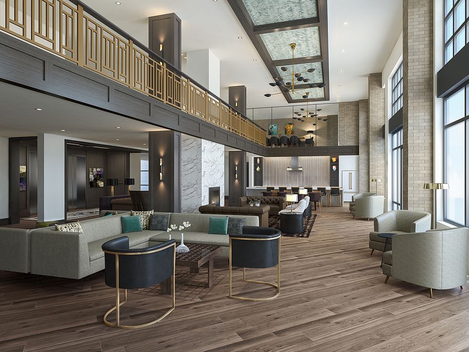 Expansive clubroom equipped with HDTV, gathering spaces and demonstration kitchen
