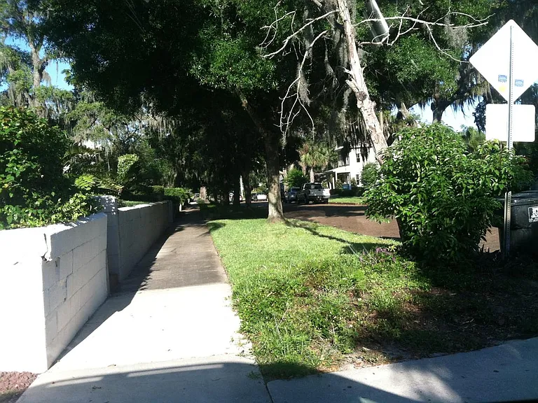 looking up the street from the sidewalk