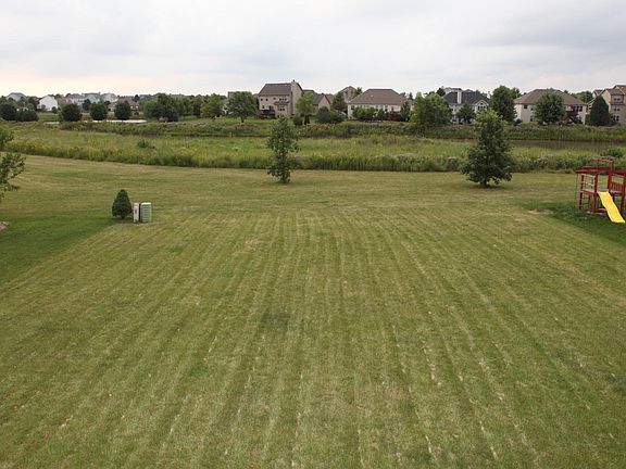 Very large back yard facing pond