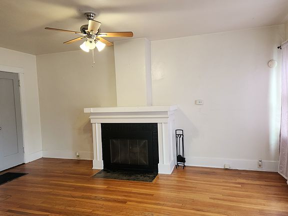 Living Room with Fireplace and Ceiling Fan