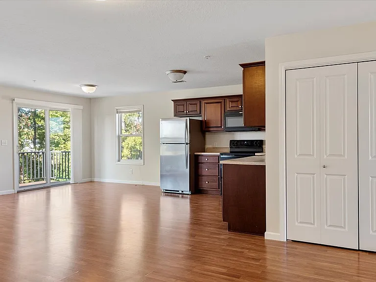 VIEW TO LIVING ROOM AND REAR PATIO