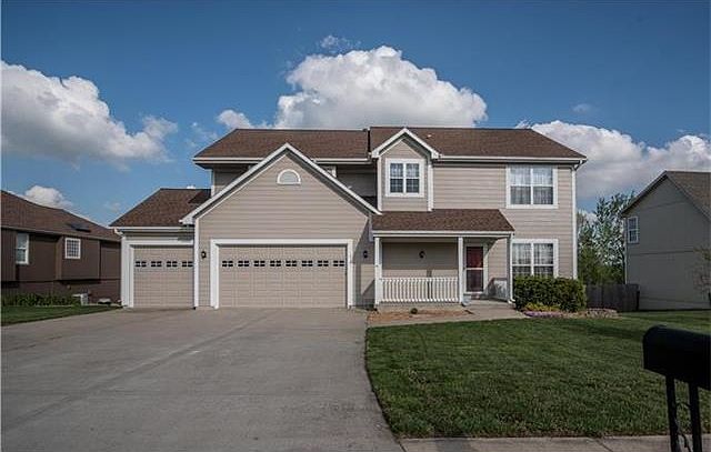 Welcome to 613 N Walnut Lane, Lone Jack, Missouri 64070.   This beautiful home is located in Whispering Hills Subdivision.