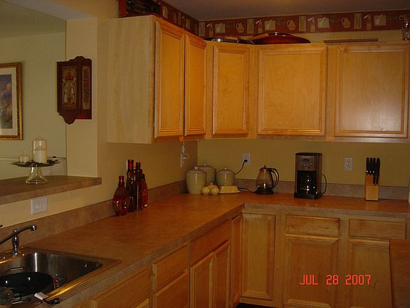 Kitchen looking into dining room and living room