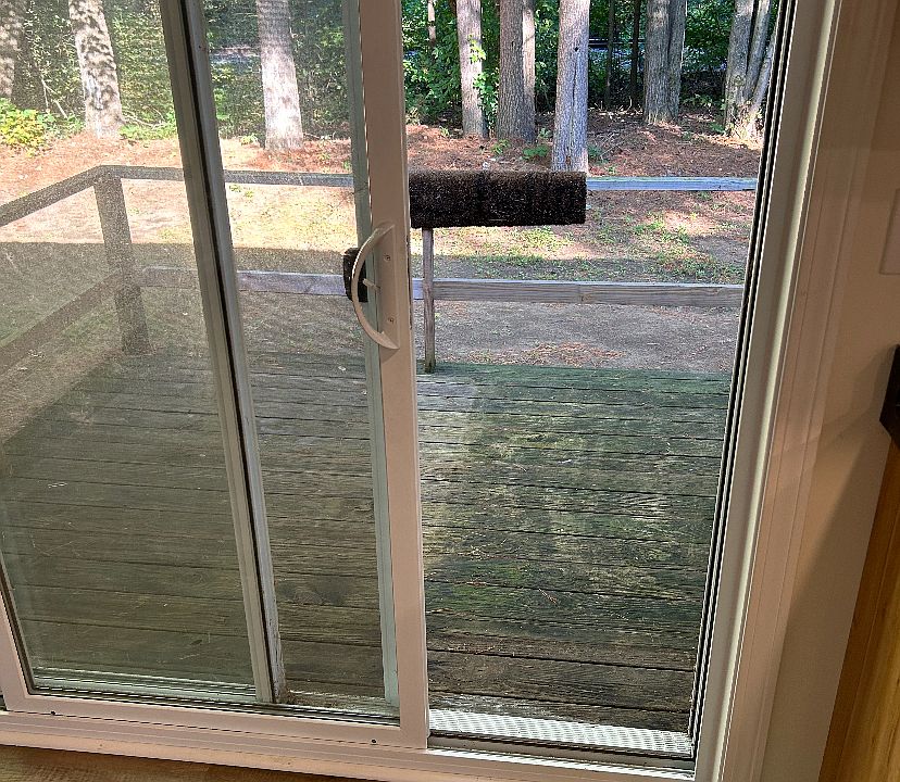 Private back deck off dining area sliding door leading to quiet back yard