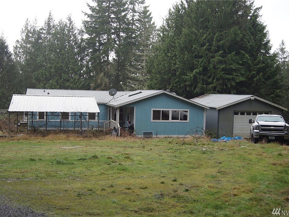 View of home, carport and garage.