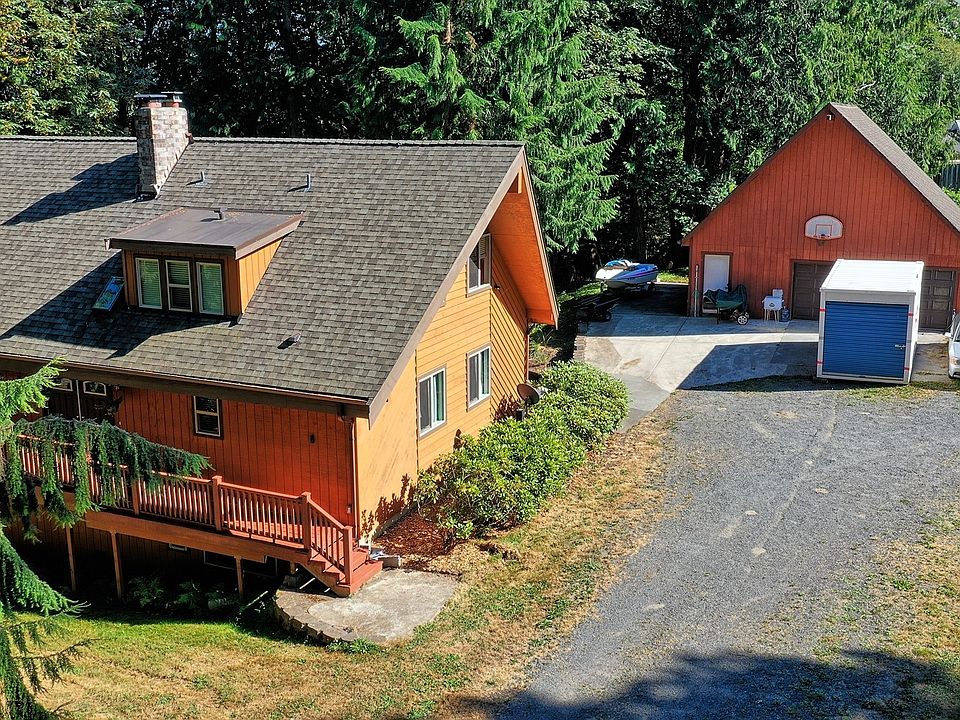 2,664 square feet home with 2 car garage and shop on 5.2 acres.>