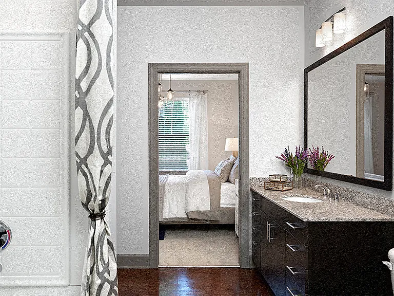 Baths with large soaking tubs, granite countertops, and framed mirrors