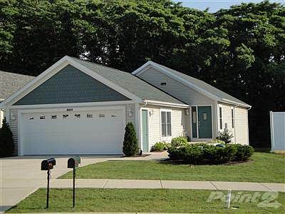 Front elevation of Unit 3021.  The association assures that the lawn is maintained and snow is removed.  Life at The Village is relaxed.