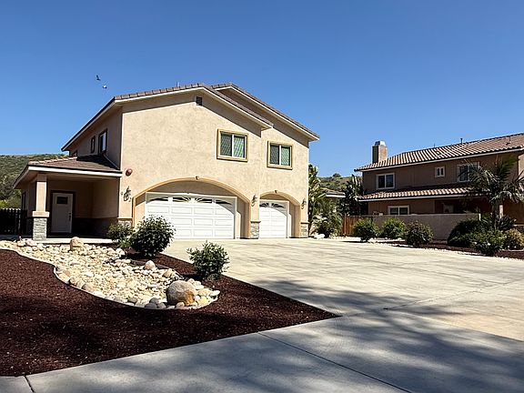 Front yard of home, 3-car garage