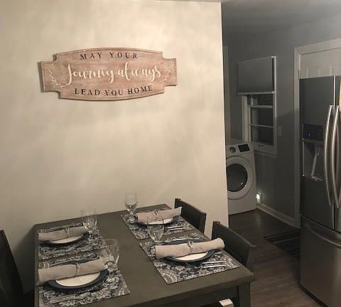 Breezeway door to the garage is in laundry room, to the left of the Refrigerator.