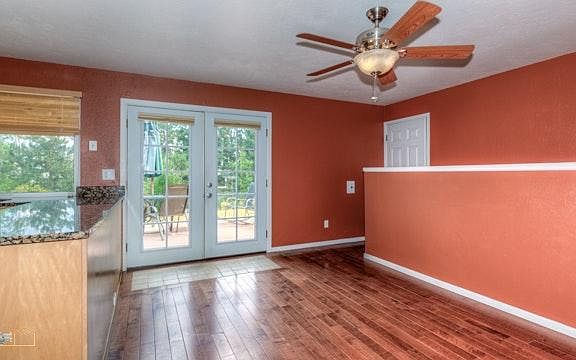 Double doors open to deck and yard
