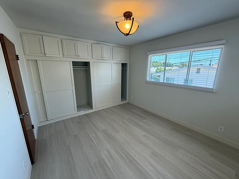 Bedroom with large closets and cupboards