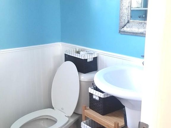 Bathroom area with wainscotting.