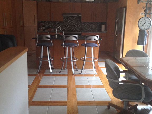 Tile with hard wood floor