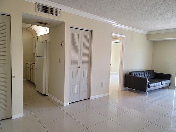 View from living room towards kitchen and second bedroom