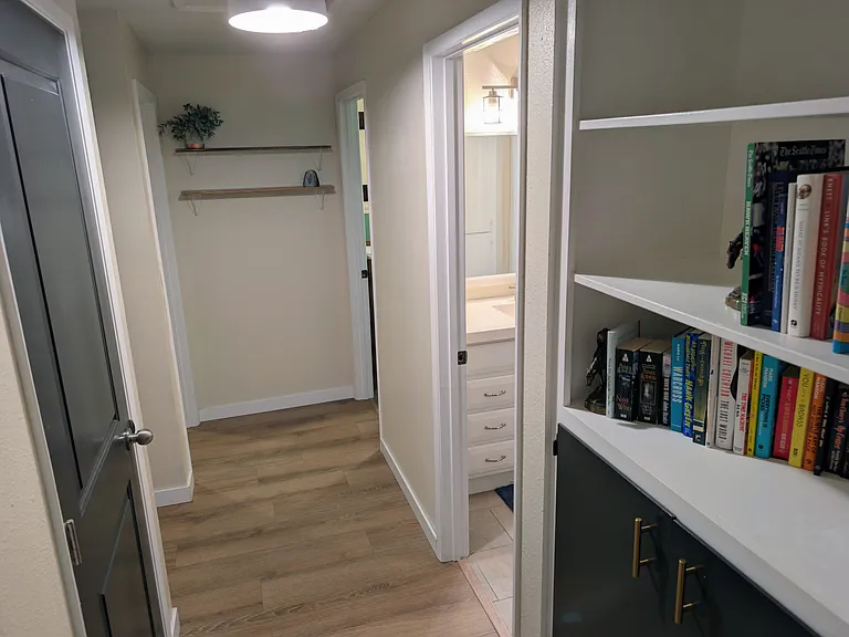 Hallway showing Main Bathroom, leading to bedrooms