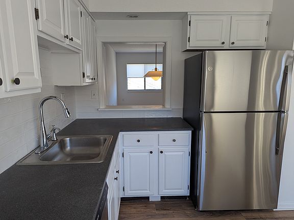 The Kitchen reach through leads to the dining area in the Living/Dining Room