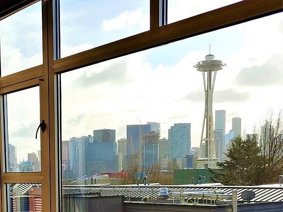 Space Needle and city view from floor-to-ceiling windows.