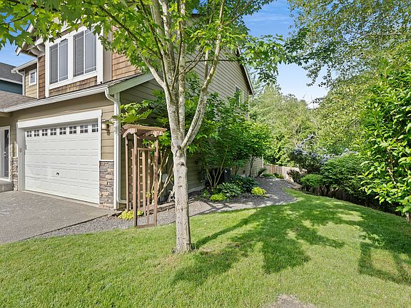 Home side yard shown in the spring, prior to exterior painting